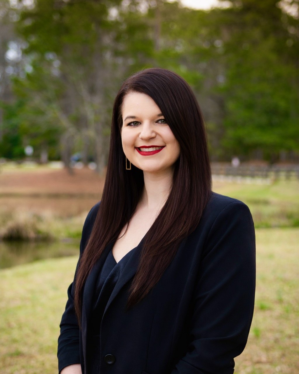 Desiree Steele, assistant creative director of Reel Time Films, smiling outdoors